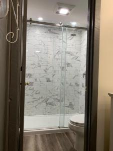 a bathroom with a glass shower with a toilet at Ski in/out Spruce Glen Townhomes on Great Eastern Trail in Killington