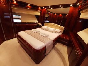 a bed in the middle of a room at Rent Luxury Motor Yacht in Barcelona