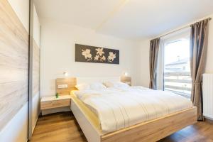 A bed or beds in a room at Appartments zum Beck