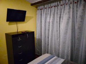 TV a/nebo společenská místnost v ubytování Villa Suite Emanuel