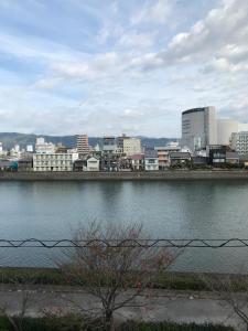 a body of water with a city in the background at 鏡水旅館/kyousuiryokan in Kochi