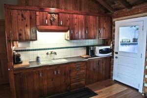 Η κουζίνα ή μικρή κουζίνα στο Main Cabin - STARRY NIGHTS cabin +13 φωτογραφίες