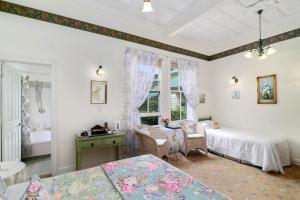 מיטה או מיטות בחדר ב-Country Villa Estate