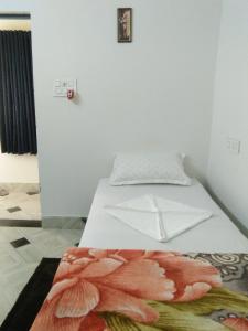 Postel nebo postele na pokoji v ubytování Sukun Guest House