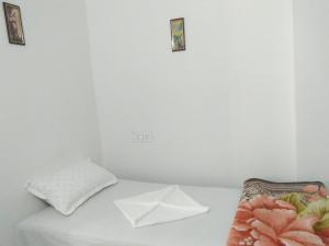 Postel nebo postele na pokoji v ubytování Sukun Guest House