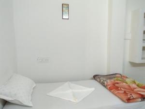 Postel nebo postele na pokoji v ubytování Sukun Guest House