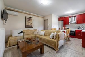 a living room with a couch and a table at Castellano Vasiliki in Vasilikí