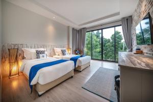Voodi või voodid majutusasutuse Aleenta Hua Hin - Pranburi - The Small Luxury Hotels of the World toas