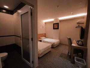 Postel nebo postele na pokoji v ubytování Prescott Hotel Bukit Bintang