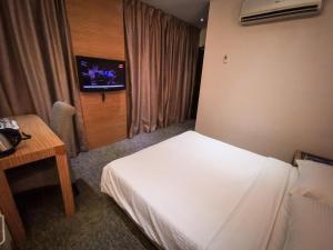 Postel nebo postele na pokoji v ubytování Prescott Hotel Bukit Bintang