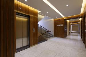 a hallway with a staircase in a building at HOTEL FLOURISH INTERNATIONAL in Ahmedabad