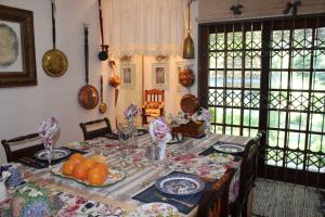 a dining room with a table with food on it at Mia's in Tzaneen