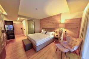 Rúm í herbergi á Hotel Leimer Bräu