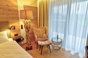 Rúm í herbergi á Hotel Leimer Bräu