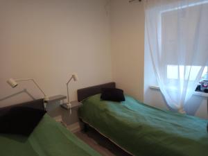 En eller flere senge i et værelse på Apartament na Zakręcie