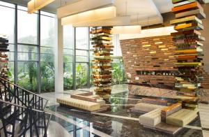 a lobby with a large stack of books at Holiday Inn Cikarang Jababeka, an IHG Hotel in Cikarang