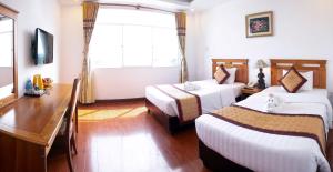 Posteľ alebo postele v izbe v ubytovaní Tre Xanh Hotel