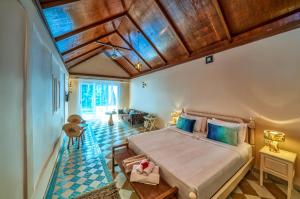 a bedroom with a large bed in a room at Munjoh Ocean Resort - Private Beachfront Luxury Retreat in Havelock in Havelock Island