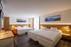 Postel nebo postele na pokoji v ubytování Hotel Bernerhof