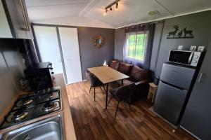 Kuchyň nebo kuchyňský kout v ubytování Le cottage