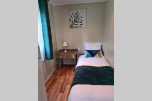 Postel nebo postele na pokoji v ubytování Le cottage