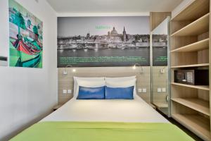 Postel nebo postele na pokoji v ubytování Hotel Santana