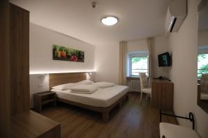 Postel nebo postele na pokoji v ubytování Hotel Stampfer B&B + 37 fotografií