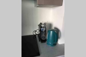 a kitchen counter with a coffee maker and a blender at Le Gallienice au cœur de la ville in Nice