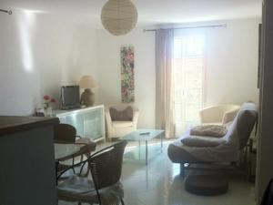 a living room with a couch and a table at Appartement Citadelle in Corte