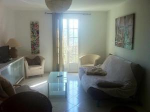 a living room with a couch and a table at Appartement Citadelle in Corte