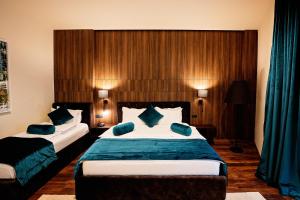 Postel nebo postele na pokoji v ubytování Premium Park Hotel
