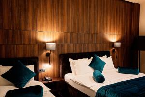 Postel nebo postele na pokoji v ubytování Premium Park Hotel