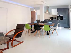 a kitchen and dining room with a table and chairs at Holiday Home Starci - LBN406 by Interhome in Labin