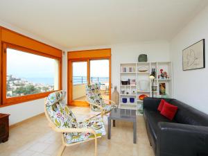 a living room with a couch and two chairs at Apartment Las Alondras-2 by Interhome in Roses