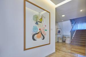 a painting of a peacock on a wall in a hallway at Hotel Joan Miró Museum in Palma de Mallorca