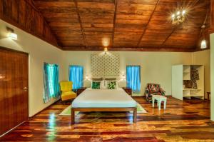 a bedroom with a large bed in a room at Munjoh Ocean Resort - Private Beachfront Luxury Retreat in Havelock in Havelock Island