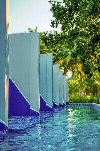 a pool with blue and white dividers in the water at Munjoh Ocean Resort - Private Beachfront Luxury Retreat in Havelock in Havelock Island