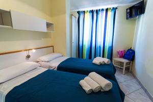 Postel nebo postele na pokoji v ubytování Hotel Residence Riviera Calabra + 88 fotografií