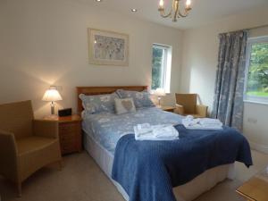 a bedroom with a bed with towels on it at Copper Meadow in Launceston