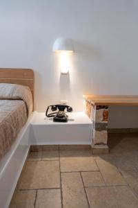 A bed or beds in a room at Filoxenia Apartments