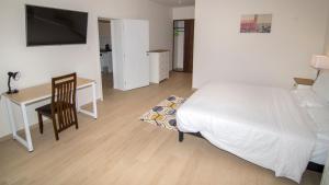Postel nebo postele na pokoji v ubytování New Brookfields Hotel