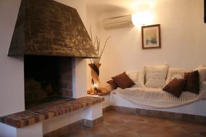 a living room with a couch and a fireplace at Résidence A Licetta in Porto-Vecchio +82 photos