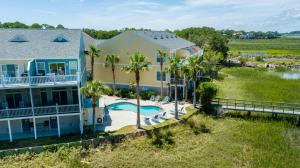 an aerial view of a house with a pool and palm trees at Turtle BAY 10 in Folly Beach