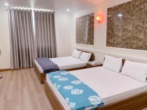 Un pat sau paturi într-o cameră la Đình Vũ 3 Motel