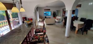 a living room with a bar and a living room at Casa Del Sol in L'Ametlla de Mar