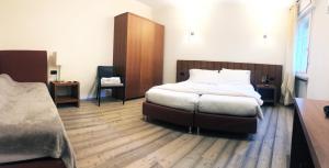 Postel nebo postele na pokoji v ubytování Antica Trattoria
