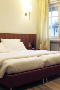 Postel nebo postele na pokoji v ubytování Antica Trattoria