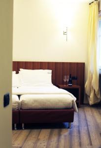 Postel nebo postele na pokoji v ubytování Antica Trattoria
