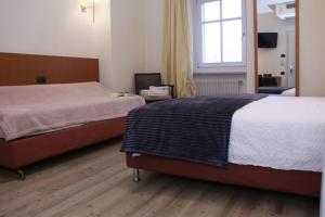 Postel nebo postele na pokoji v ubytování Antica Trattoria