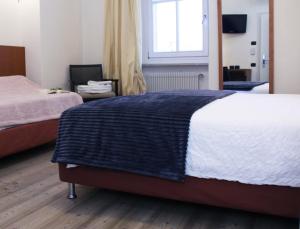 Postel nebo postele na pokoji v ubytování Antica Trattoria